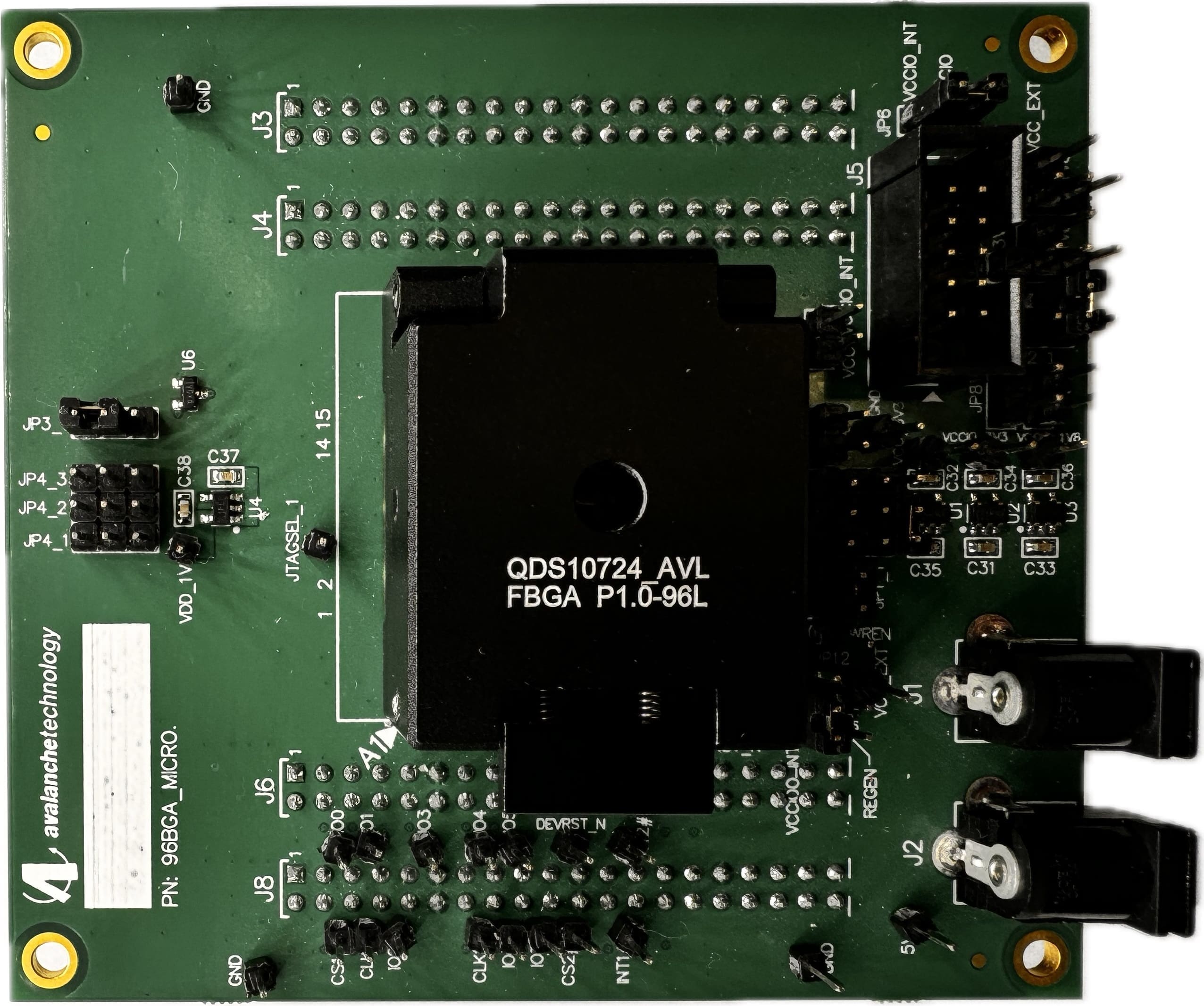 Green printed circuit board with various electronic components.